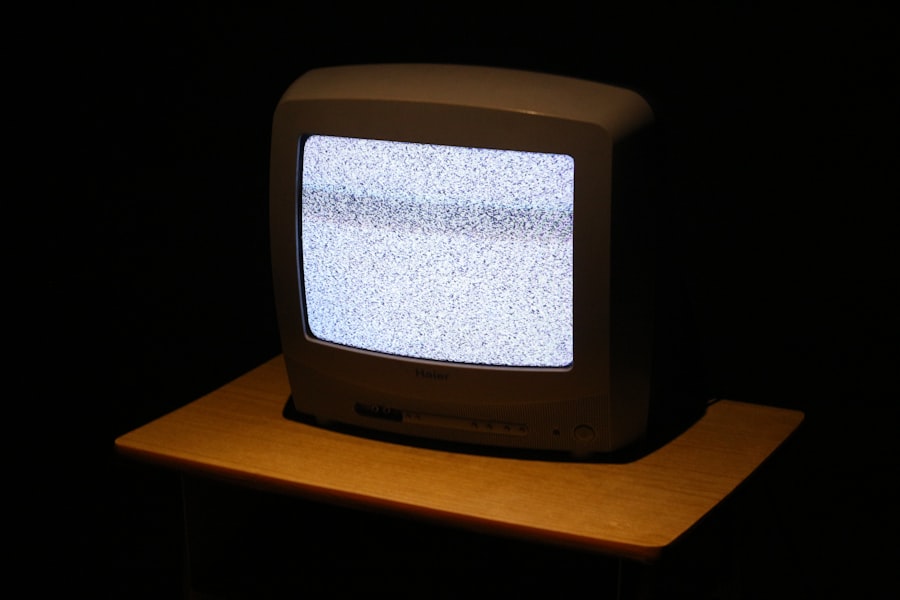 A vintage CRT screen glowing in the dark, the phosphor bloom visible around the image